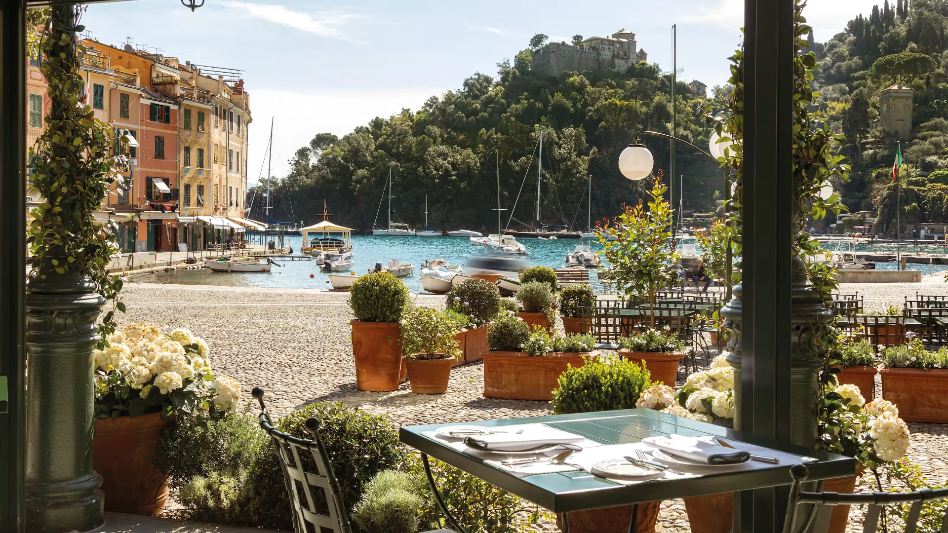 A sunlit terrace overlooking the Portofino harbor